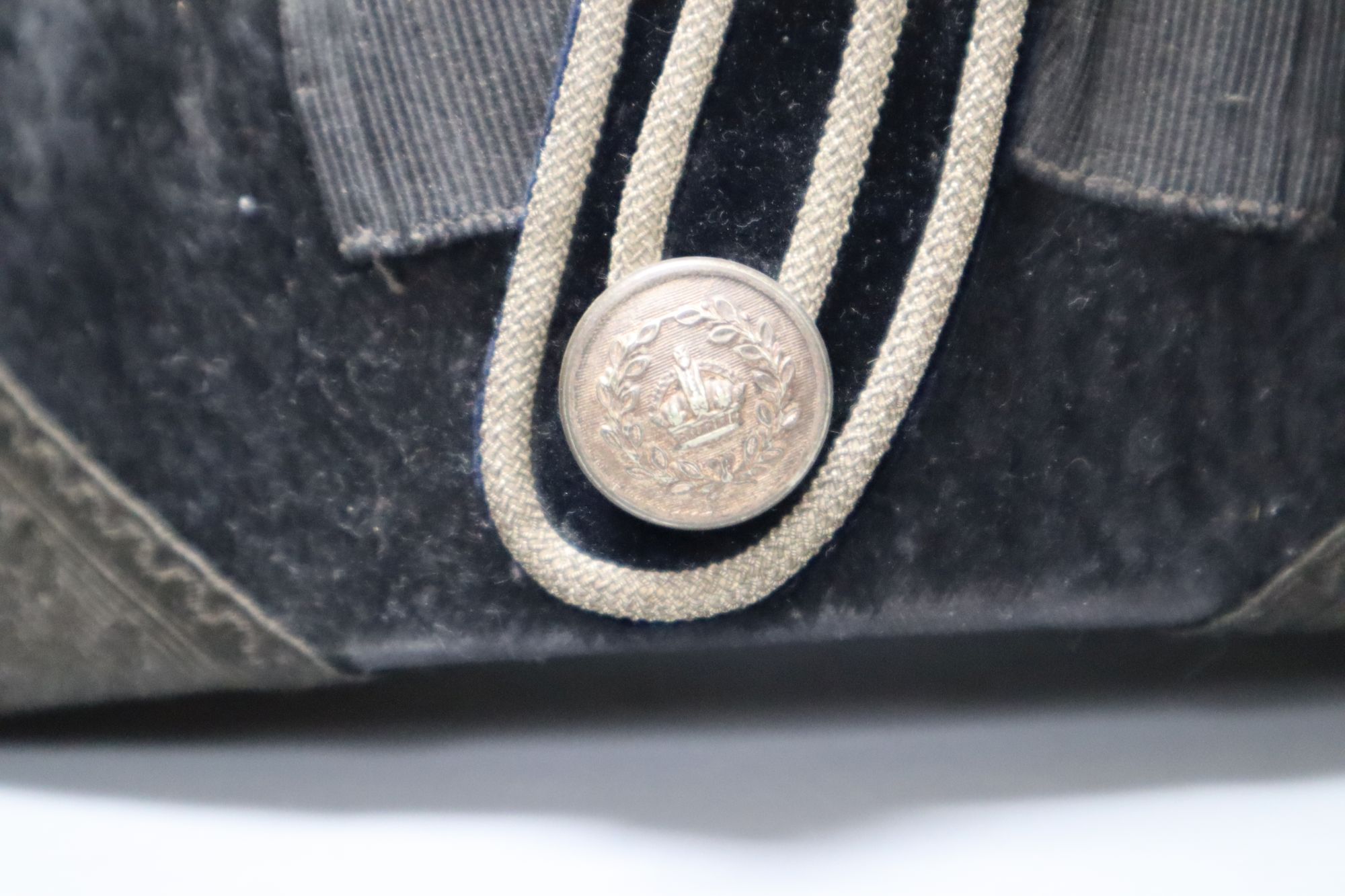 A WWI bicorn naval hat with Kings crown button